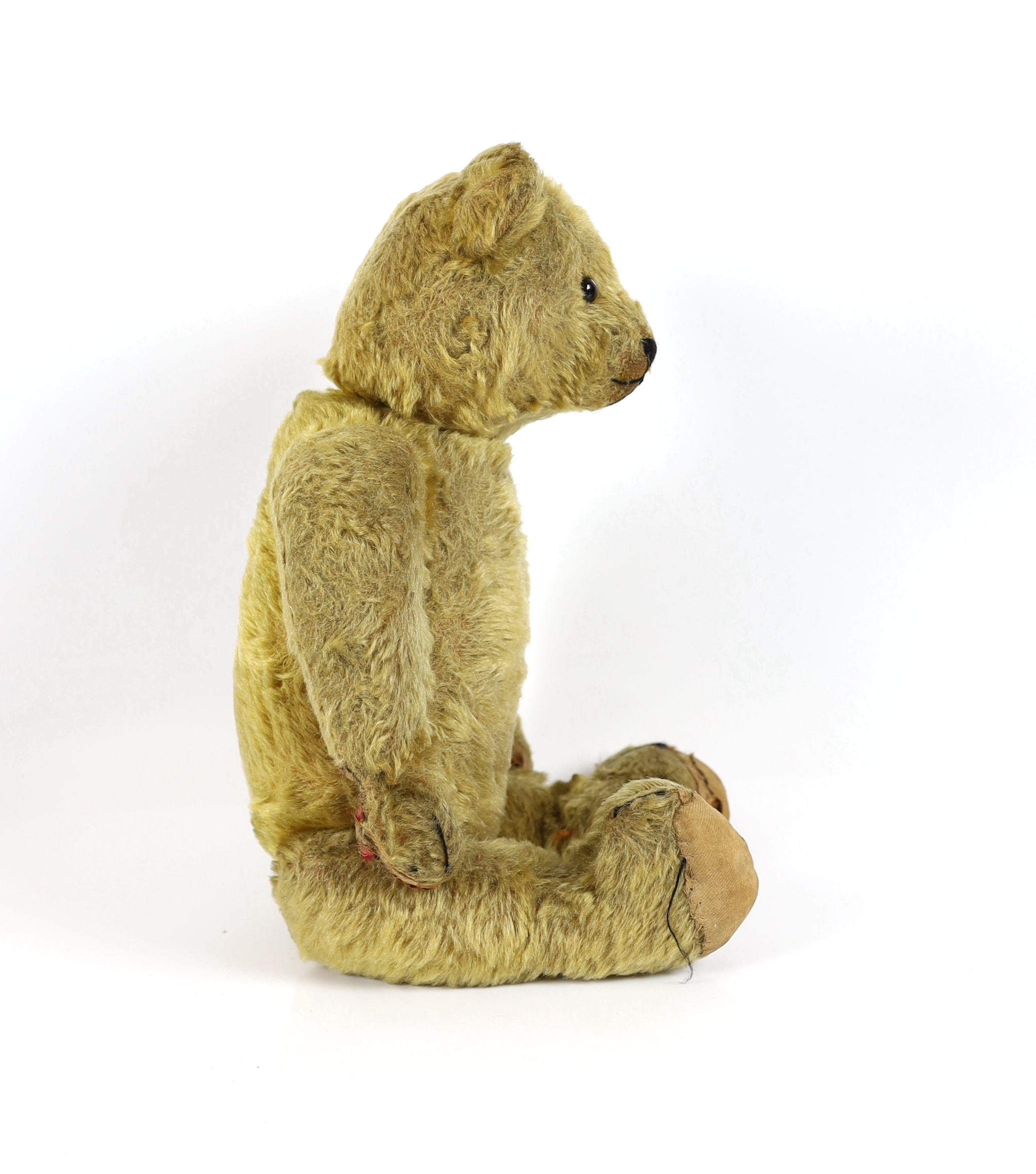 An early German bear, c.1912, black button eyes, 45cm, old repair to paws, good mohair